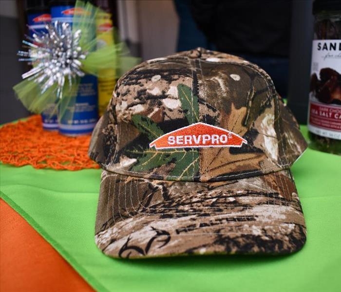 SERVPRO hat and products on raffle prize table