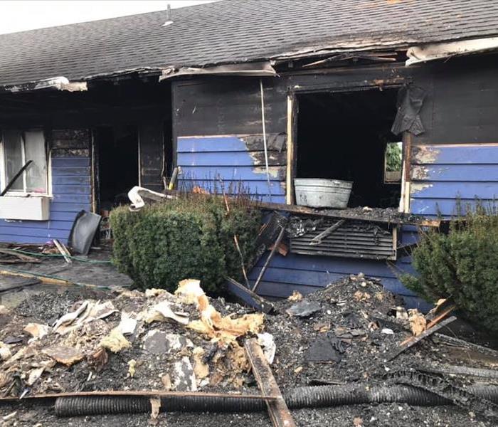 Fire damaged exterior of commercial apartments