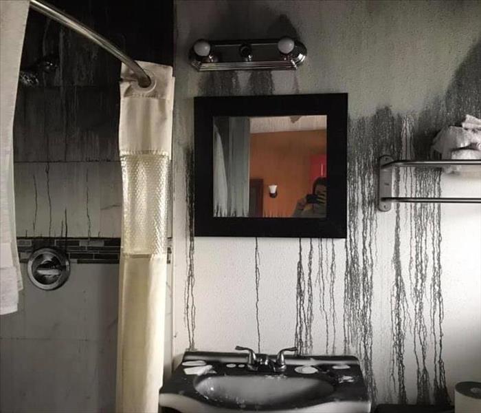 Smoke and soot damaged bathroom