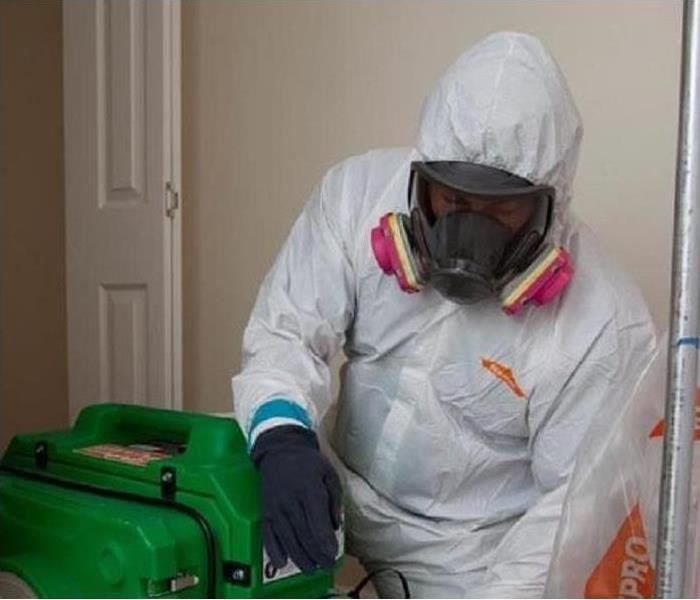 PPE suited SERVPRO employee