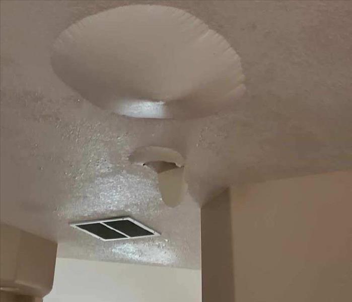 water damaged ceiling, paint bubble