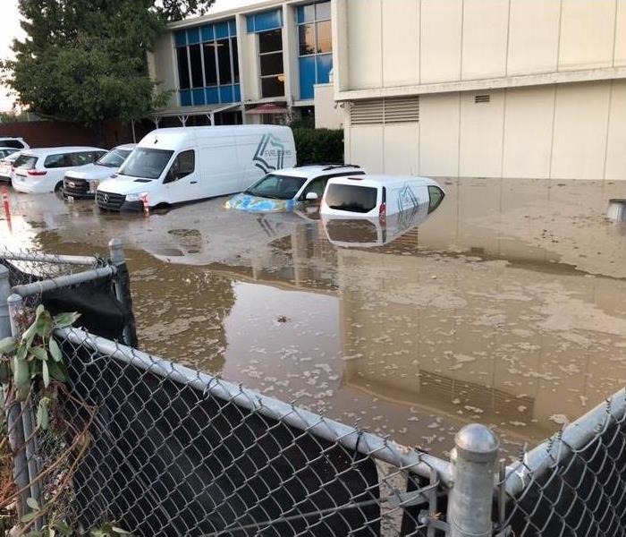 flooded commercial building parking lot and structure
