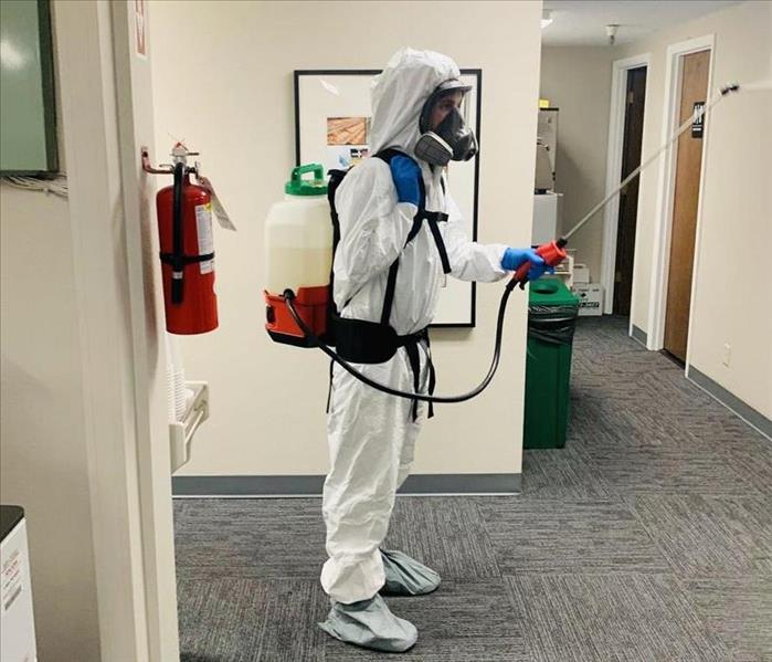 Servpro technician in proper gear for covid cleanup