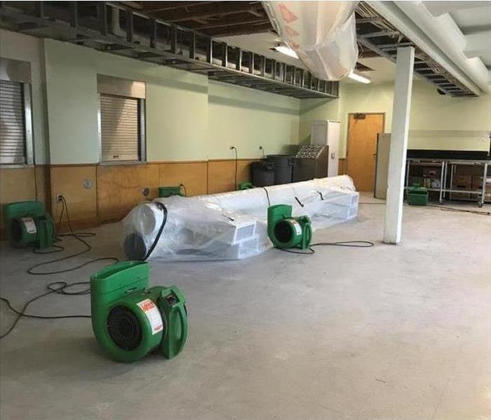 Commercial water damage with Servpro air movers