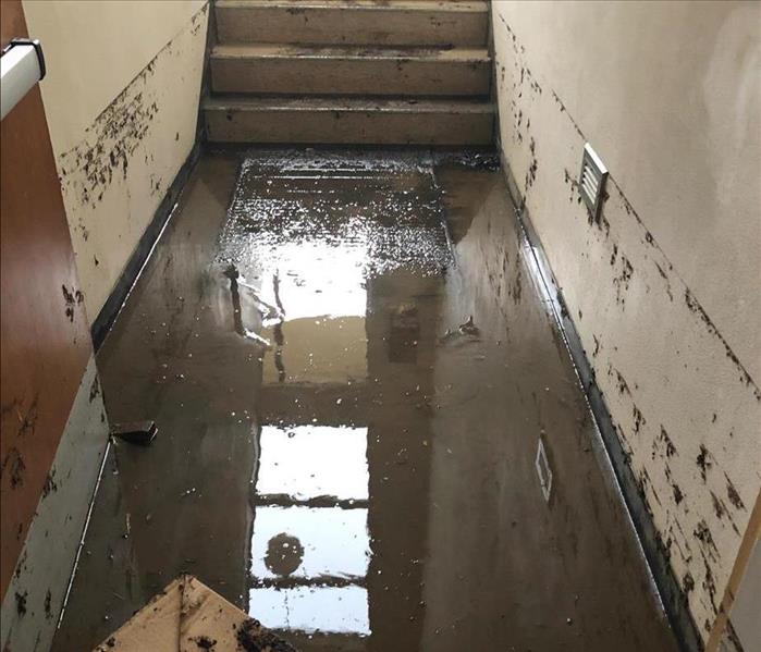 storm water damaged hallway with standing water